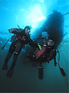 Divers below boat